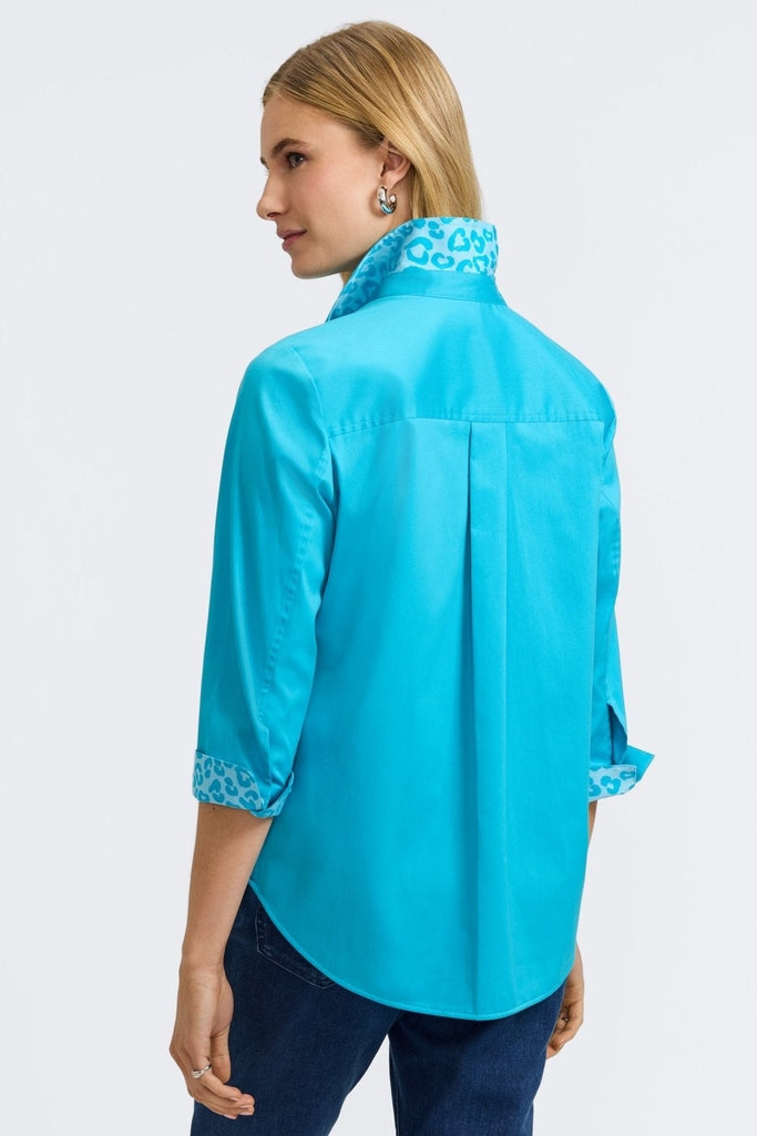 Back view of the Margie Stretch Matte Sateen 3/4 Sleeve Shirt with the cuffs folded and collar flared showing the print #color_ibiza turq
