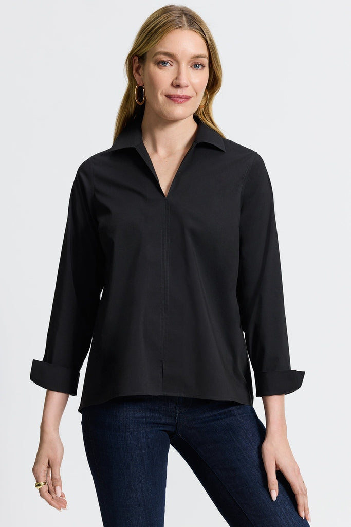 Woman in wrinkle-free Foxcroft Agnes black shirt offering effortless polish and timeless confidence. #color_black