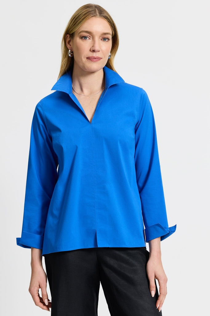 Woman in Foxcroft Agnes shirt in vibrant Cobalt blue, crisp finish with flattering silhouette