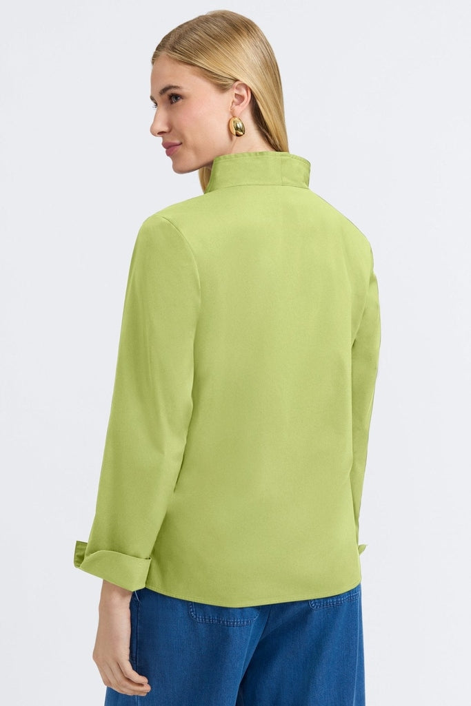 Angled back view of a woman wearing the Tammy No Iron Stretch Long Sleeve Popover Shirt #color_celery