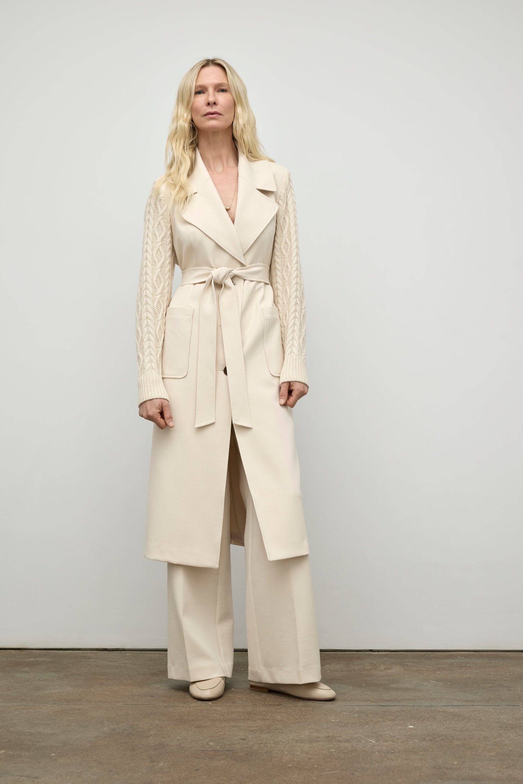 Coat with cable knit sleeve