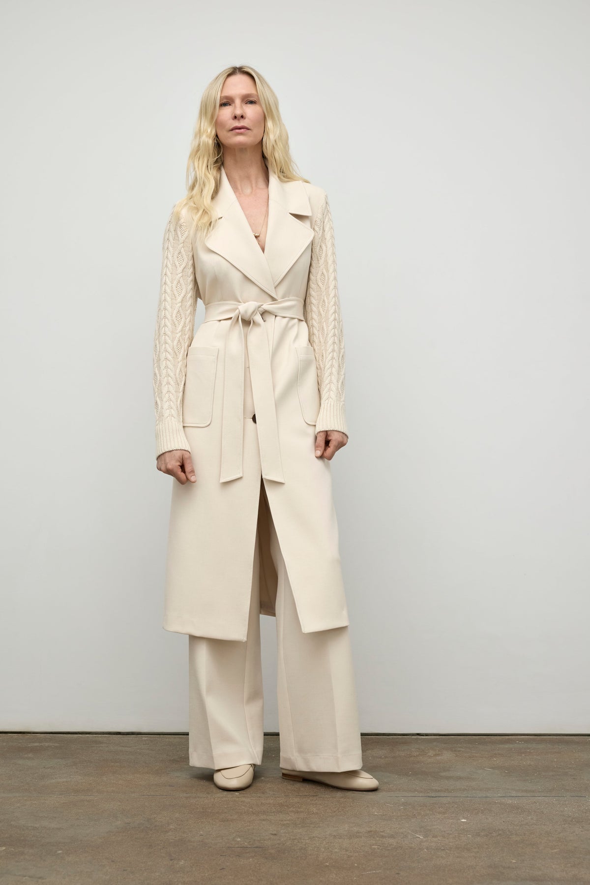 Coat with cable knit sleeve