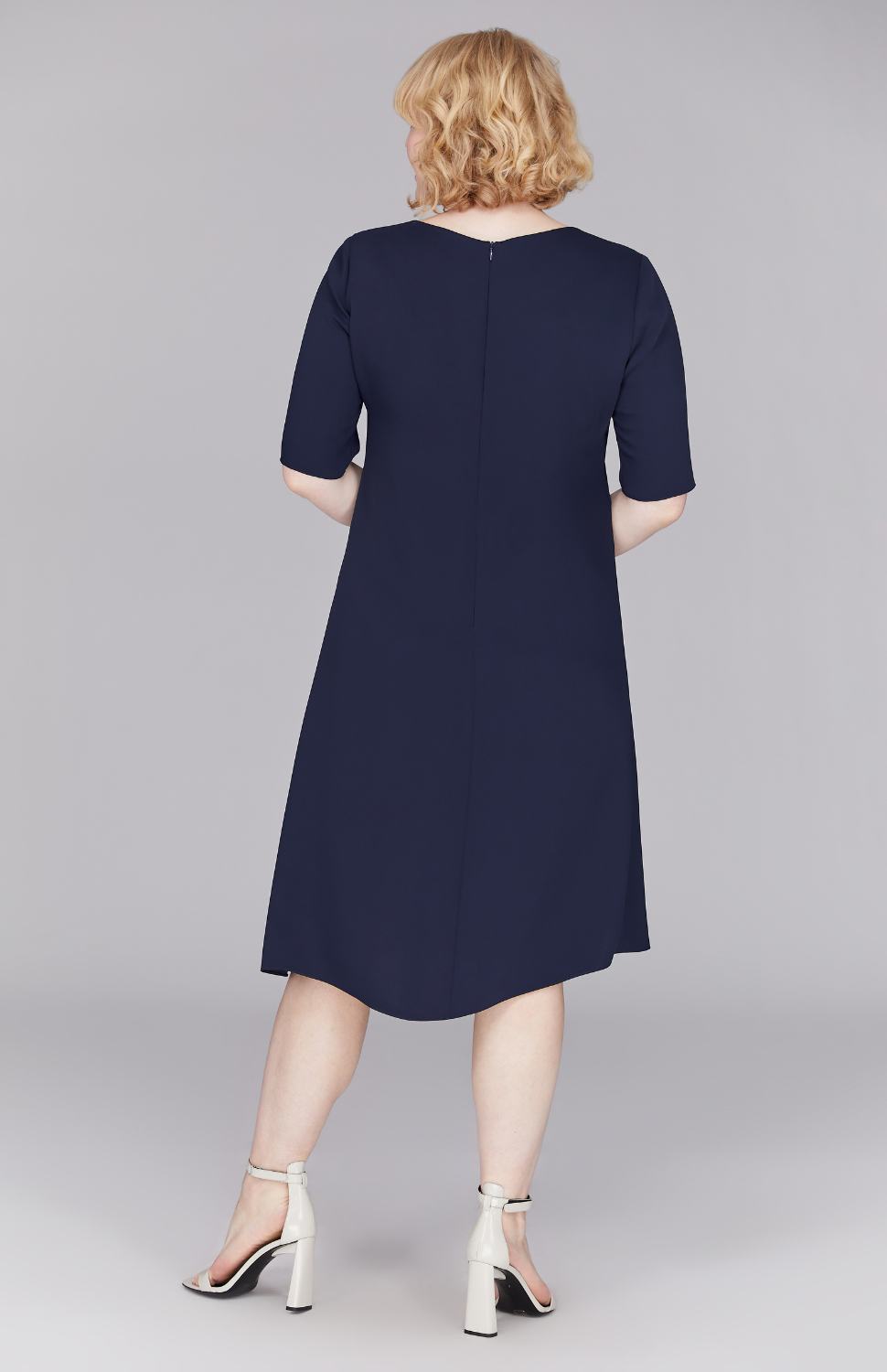 Molly is 5'8.5" and wearing Midnight in M.