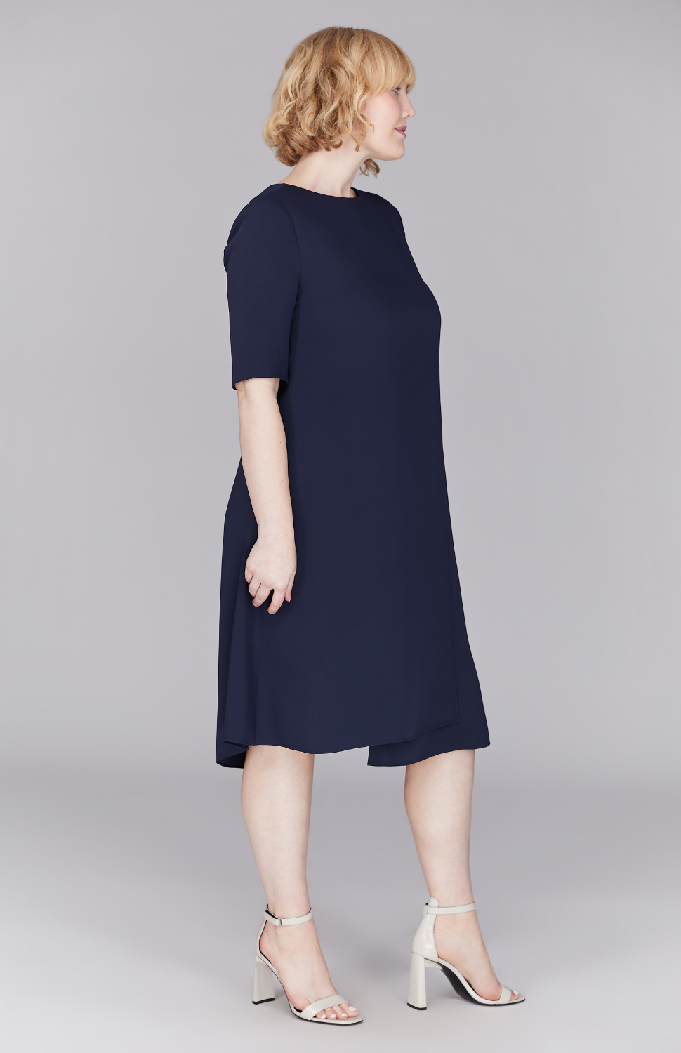 Molly is 5'8.5" and wearing Midnight in M.