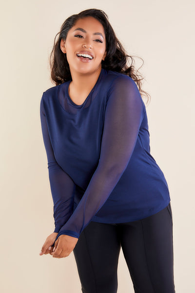 The Best Travel Top. Woman Showing the Front Profile of a Kim Mesh-Sleeve Top in Pima Modal in Navy.