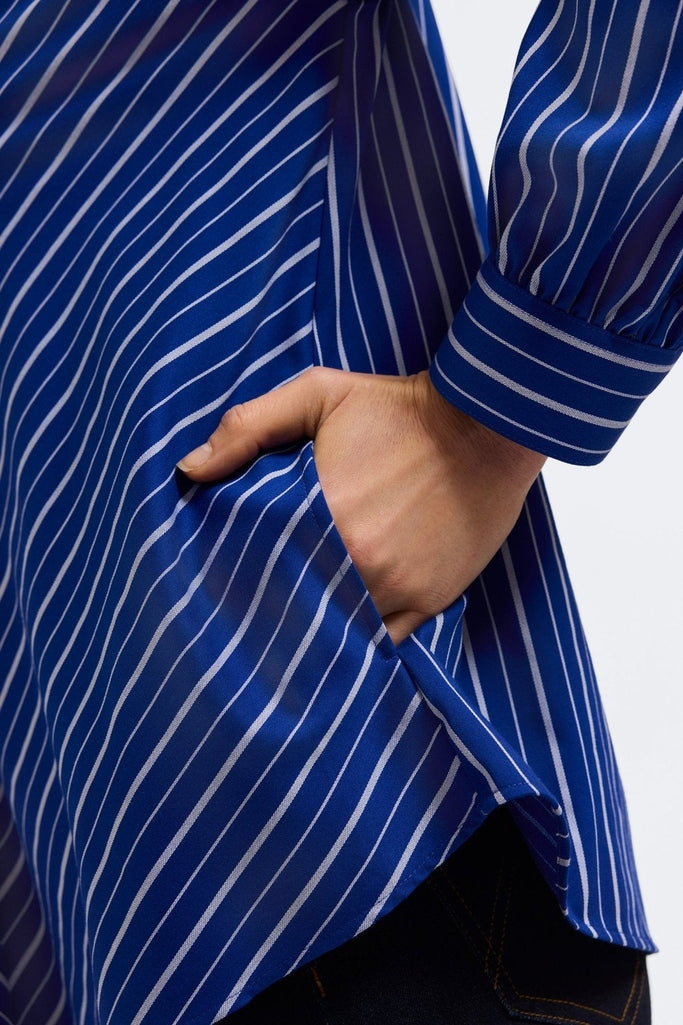 Close up of the functioning side pocket of the Daphne Classic Wide Stripe Long Sleeve Popover Shirt #color_blue & white wide stripe