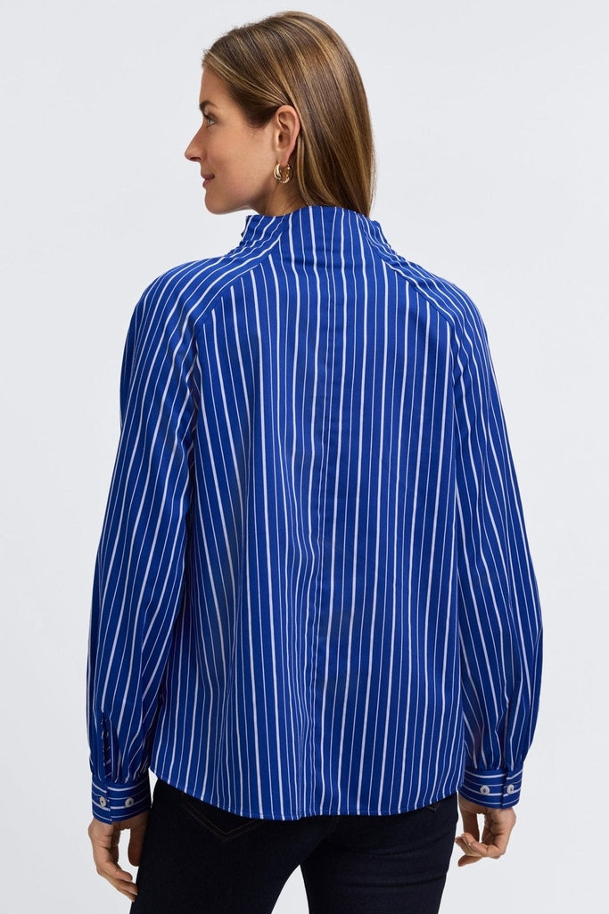 Back view of model wearing the Daphne Classic Wide Stripe Long Sleeve Popover Shirt #color_blue & white wide stripe