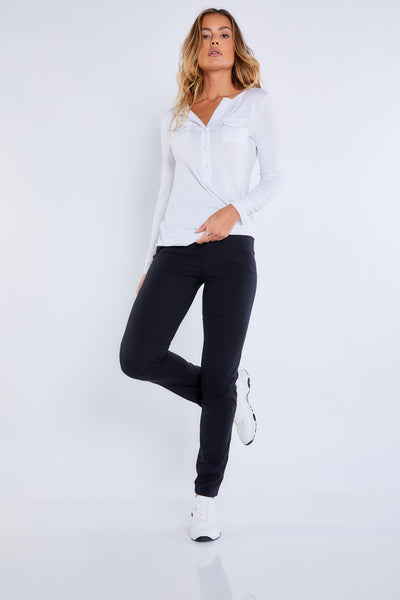 The Best Travel Shirt. Woman Showing the Front Profile of a Calista Roll up Henley Top in White