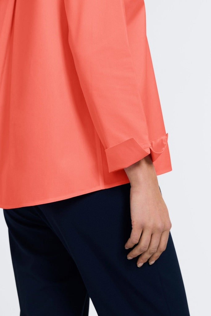 Close-up of the sleeves and flip back cuffs of the Agnes popover shirt #color_tangerine