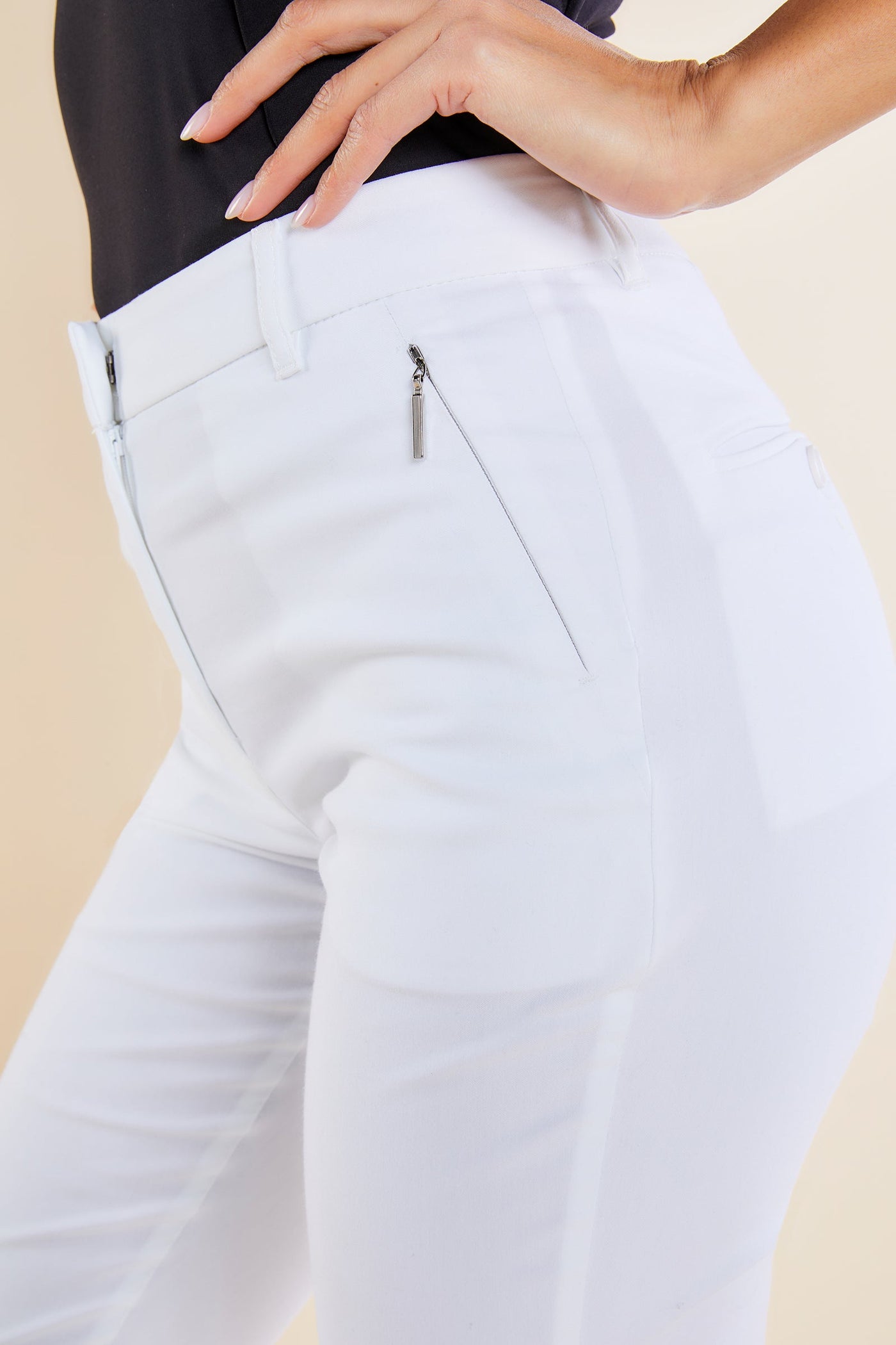 The Best Travel Pants. Side Zipper Pocket of the Thea Curvy Pant in White.