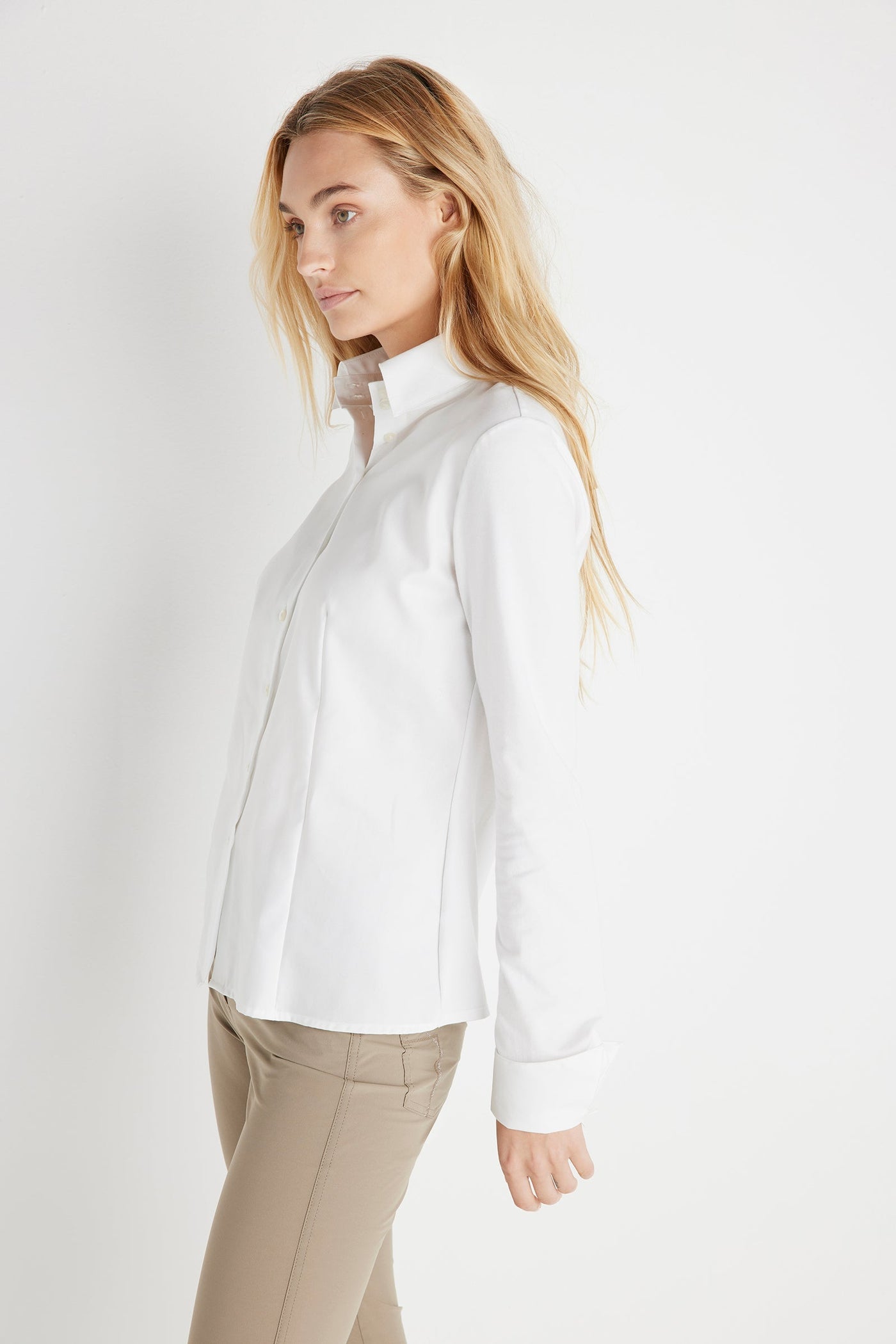 The Best Travel Button Down Poplin Shirt. Woman Showing the Sleeve of an Alida Button Down Poplin Shirt in White