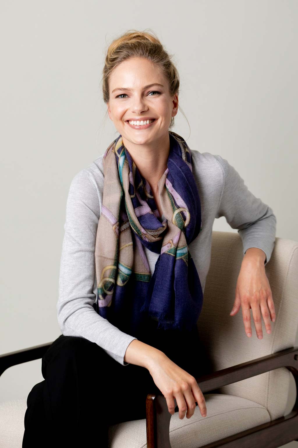 Model Wearing Alpine Cashmere's Featherweight Cinta Scarf in Blue and Taupe