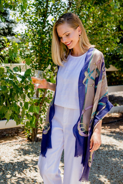 Model Wearing Alpine Cashmere's Featherweight Cinta Scarf in Blue and Taupe