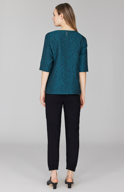 Morgan is 5' 11" and wearing Turquoise in size XS.