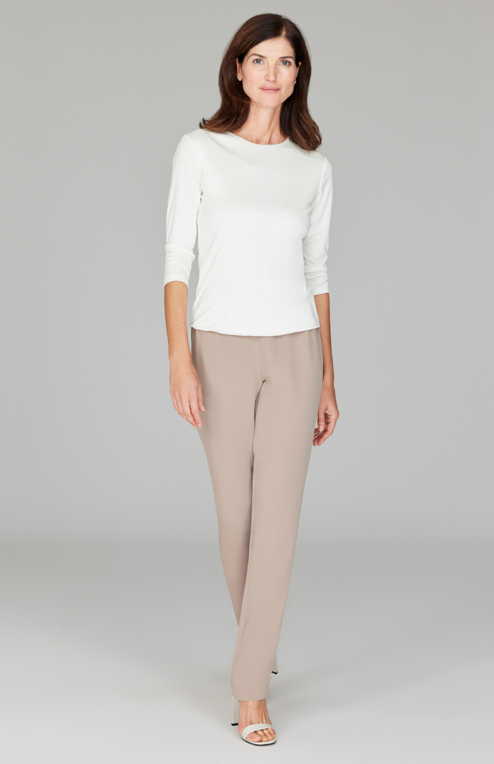 Ekaterina is 5'10" and wearing a size XS in Camel.