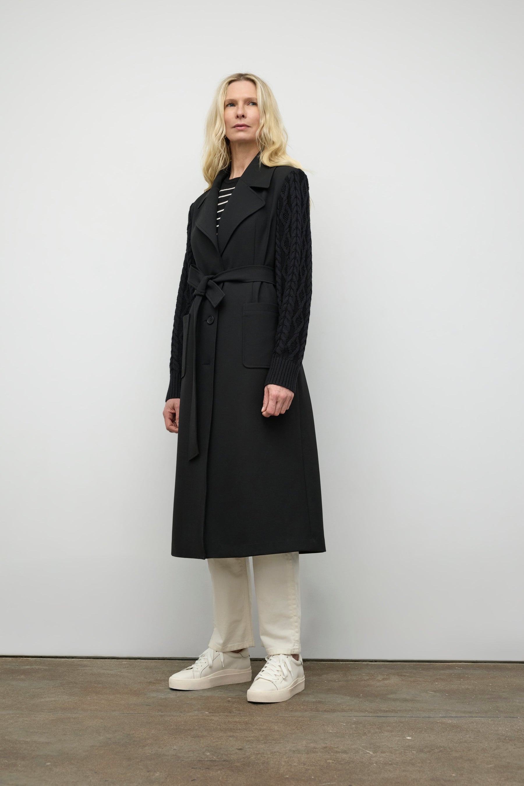 Coat with cable knit sleeve