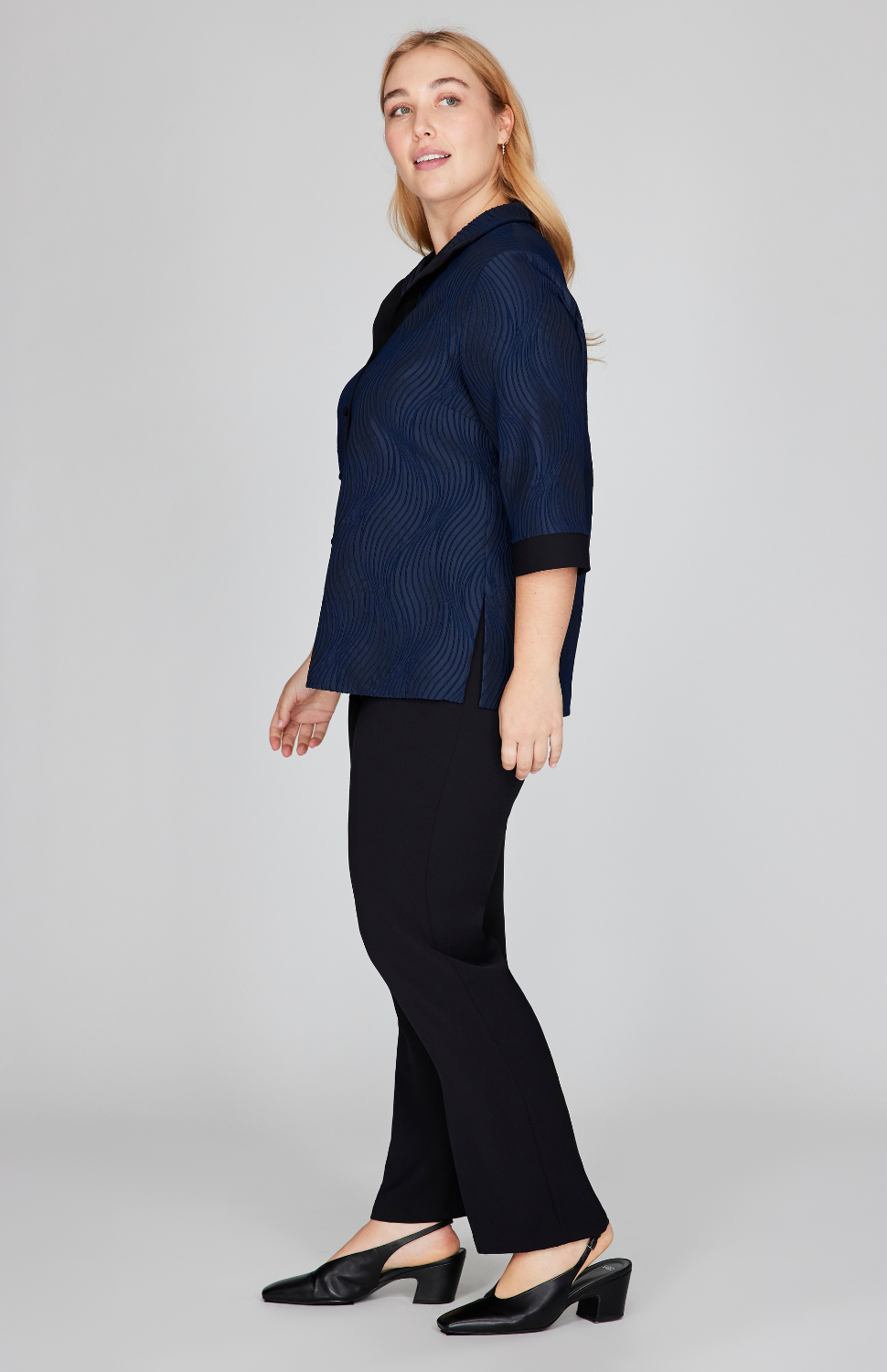 Madeline is 5'10" and wearing Midnight in size L.