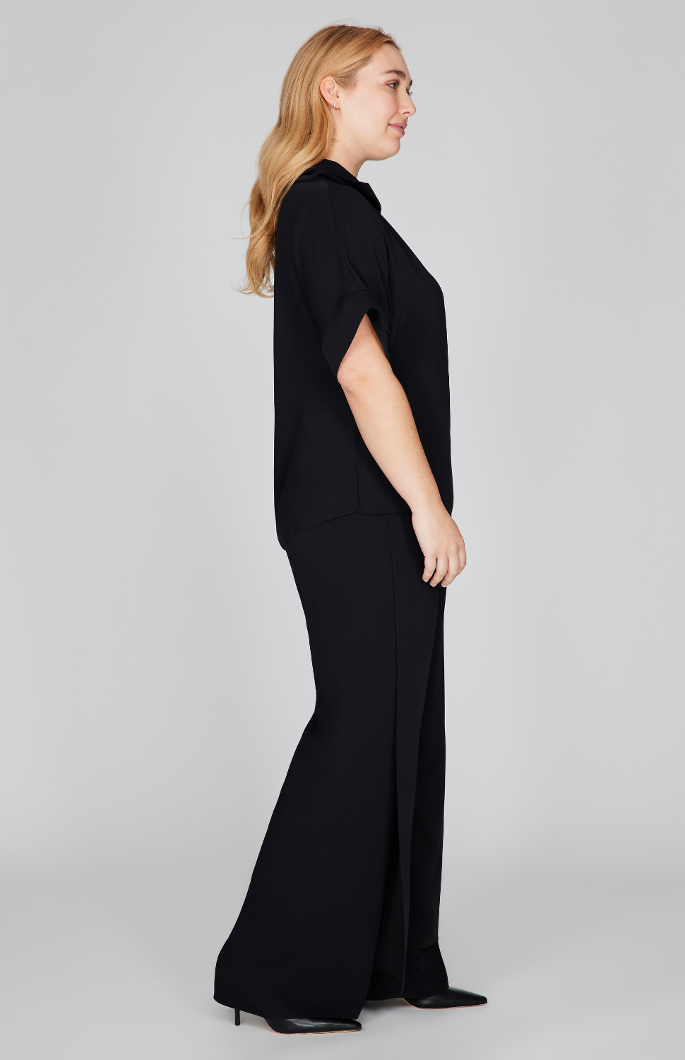 Madeline is 5'10" and wearing Black in size M.