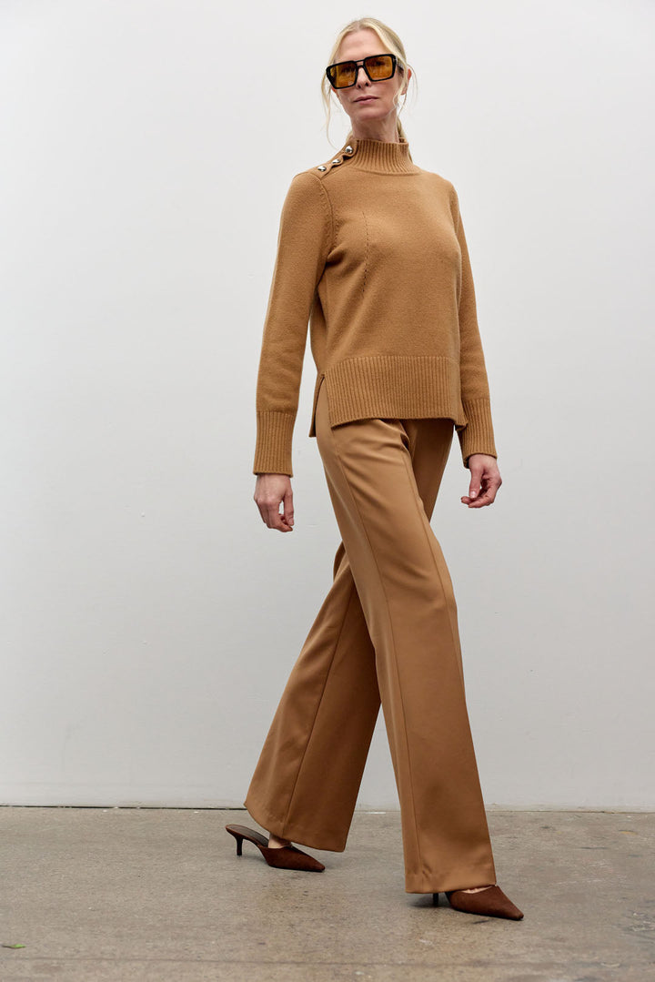 Mock neck long sleeve top with shoulder buttons