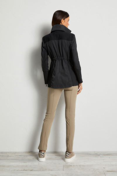 The Best Travel Jacket. Woman Showing the Back Profile of a Travel City Slick Jacket in Black