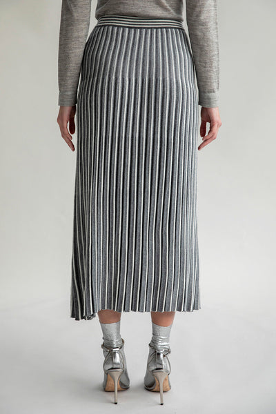 Back view of the Adeline Skirt, highlighting the pleated details and contrasting stripe design.