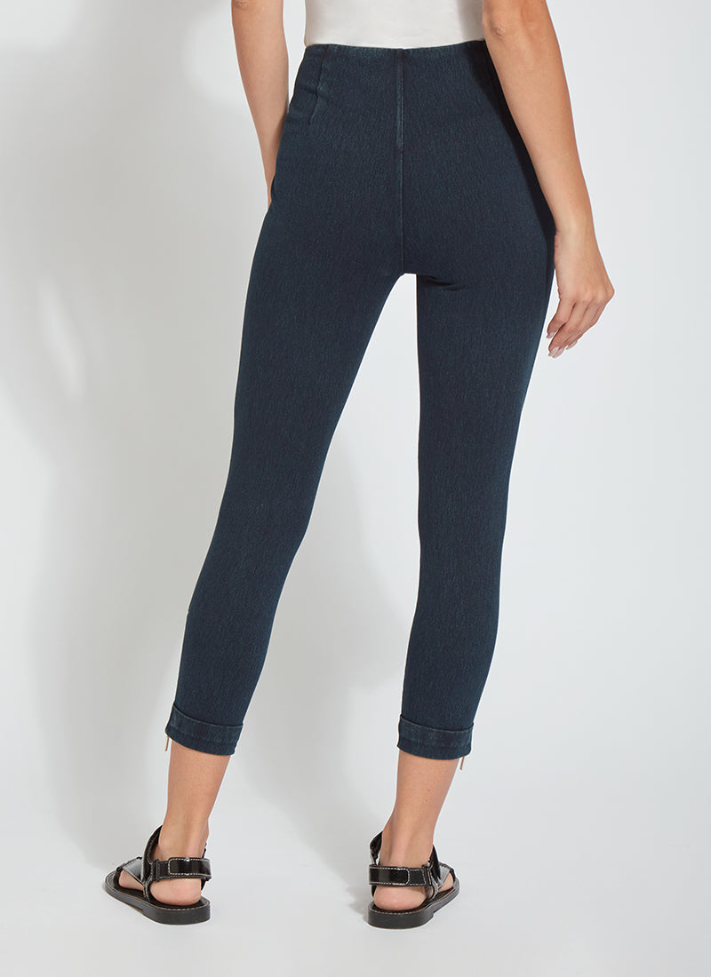 color=Indigo, back view, cropped denim jean leggings with zipper detail at hem and comfort waistband