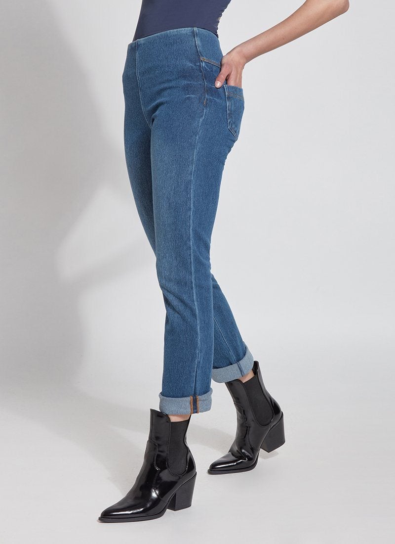 color=Mid Wash, Angled side view of mid wash blue, 4-way stretch, relaxed boyfriend denim jean legging, seen from waist down