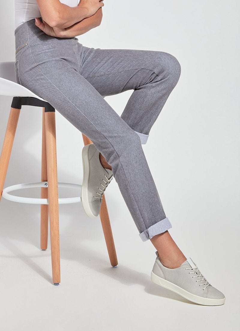 color=Uptown Grey, Seated view of uptown gray, 4-way stretch, relaxed boyfriend denim jean legging with interior waistband