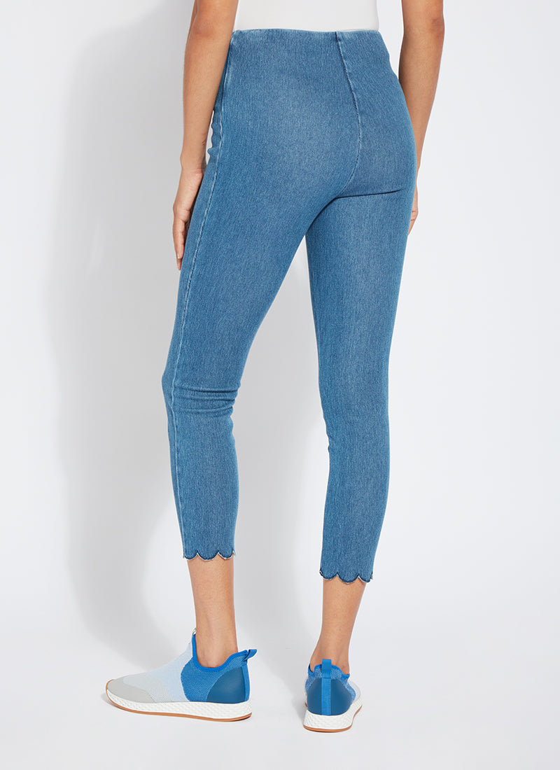 color=Mid Wash, back view, comfortable summer denim jegging with scalloped hemline. Cropped, slim legging with comfort waistband