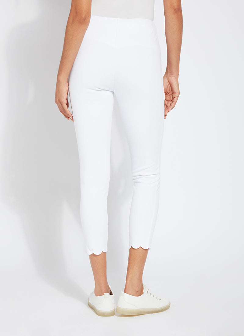 color=White, back view, comfortable summer denim jegging with scalloped hemline. Cropped, slim legging with comfort waistband