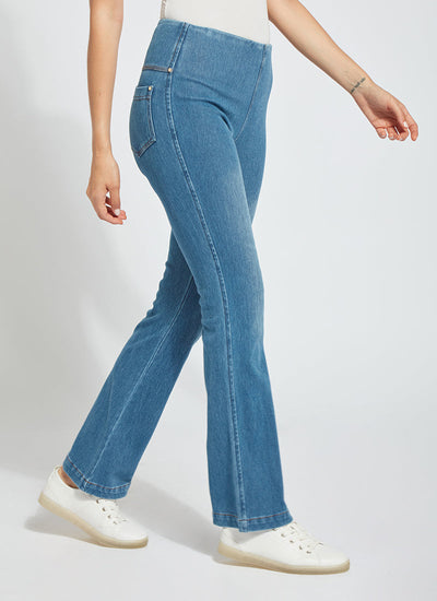 color=Mid Wash, side view, knit denim jean leggings with deep side pocket, skims hips and thighs and opens into bootcut hem
