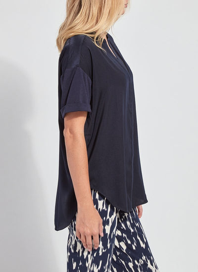 color=True Navy, side view, oversized flowy women’s shirt in stretchy knit jersey, rounded hem and drop shoulder sleeves