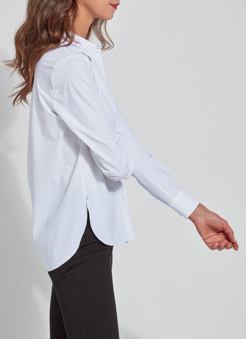 color=White, side view, slim fit women’s button up shirt with curved hem, made with wrinkle resistant microfiber