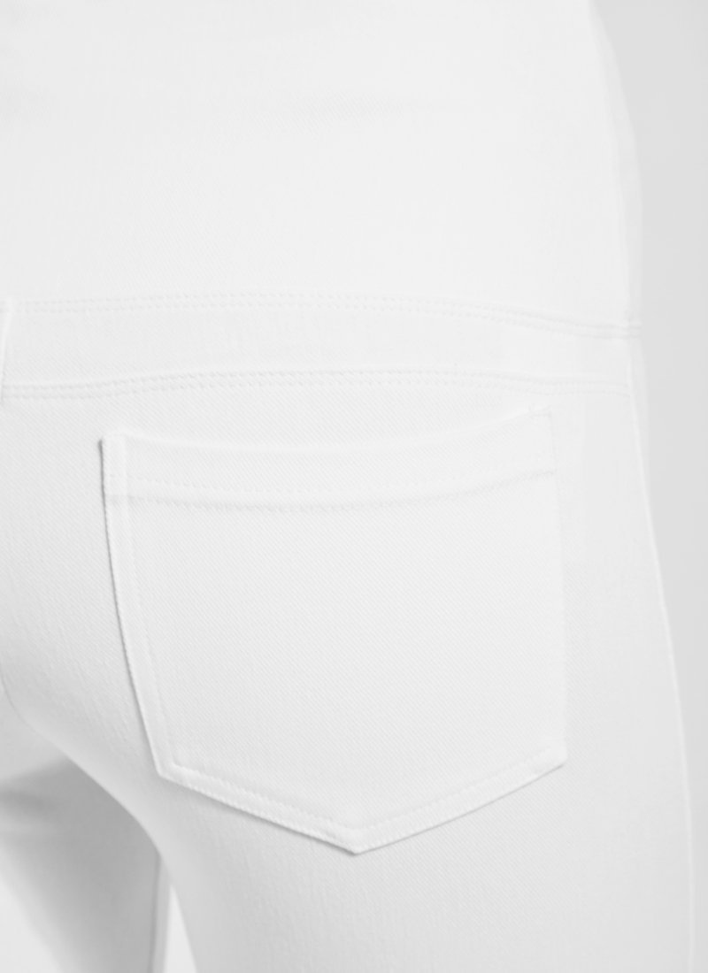 color=White, Detailed rear view of white denim straight leg jean leggings with patented concealing waistband