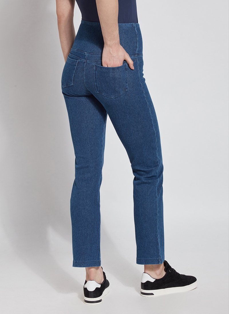 color=Mid Wash, Angled rear view mid wash blue denim straight leg jean leggings with patented concealing waistband