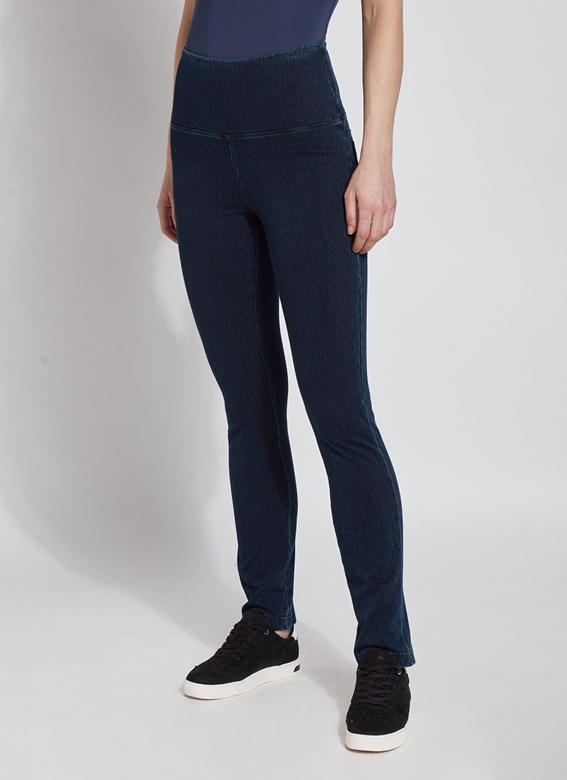 color=Indigo, Angled front view of indigo denim straight leg jean leggings with patented concealing waistband